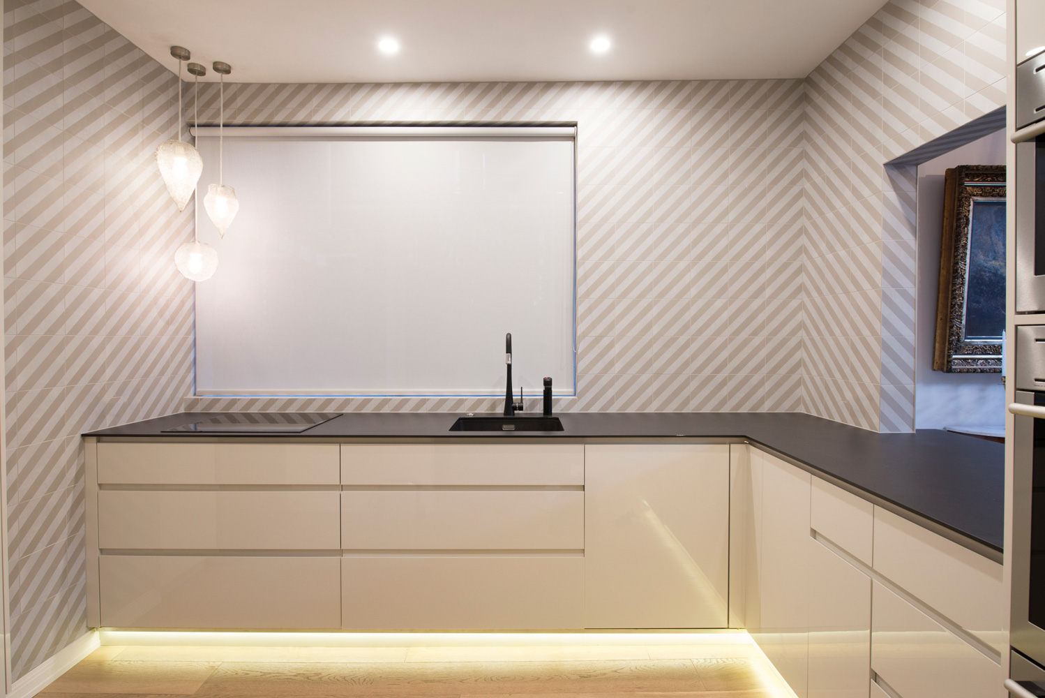 Toorak kitchen design Porcelain bench top Dekton Bench Black tap No handle kitchen Finger pull kitchen White kitchen Striped tiles Integrated dishwasher LeMans pullouts Under light kickboards Custom design kitchen Custom joinery Joinery design Bespoke joinery Kitchen design Melbourne Kitchen renovation Toorak Professional interior designer Interior designer near me Kitchen designer near me Residential design Cabinetry design Small kitchen ideas Small kitchen designer Melbourne Small kitchen designer near me what our clients say about our interior design projects