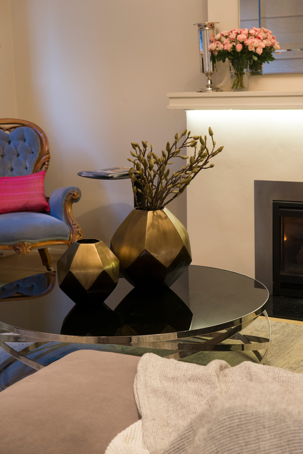 Coffee table styling Round coffee table Grandmother chair in modern fabric Black glass coffee table Kew Interior Design Kew Interior designer Toorak interior design consultant Interior designers western suburbs Melbourne Interior designers Northern suburbs Melbourne Brass decor