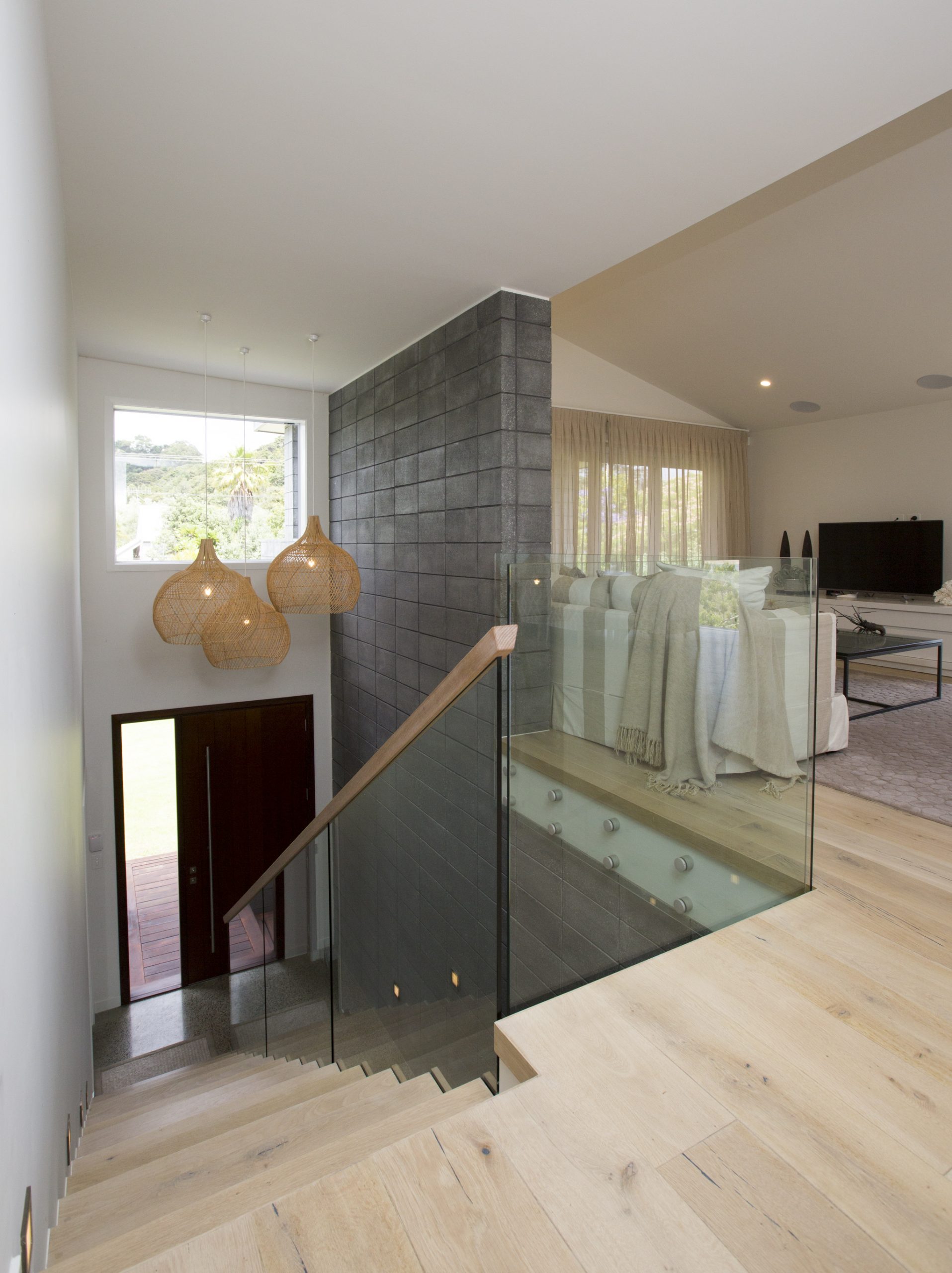 Elegant timber and white stairwell with soft lighting in Sorrento Beach House by Natasha Walker Interiors, Melbourne