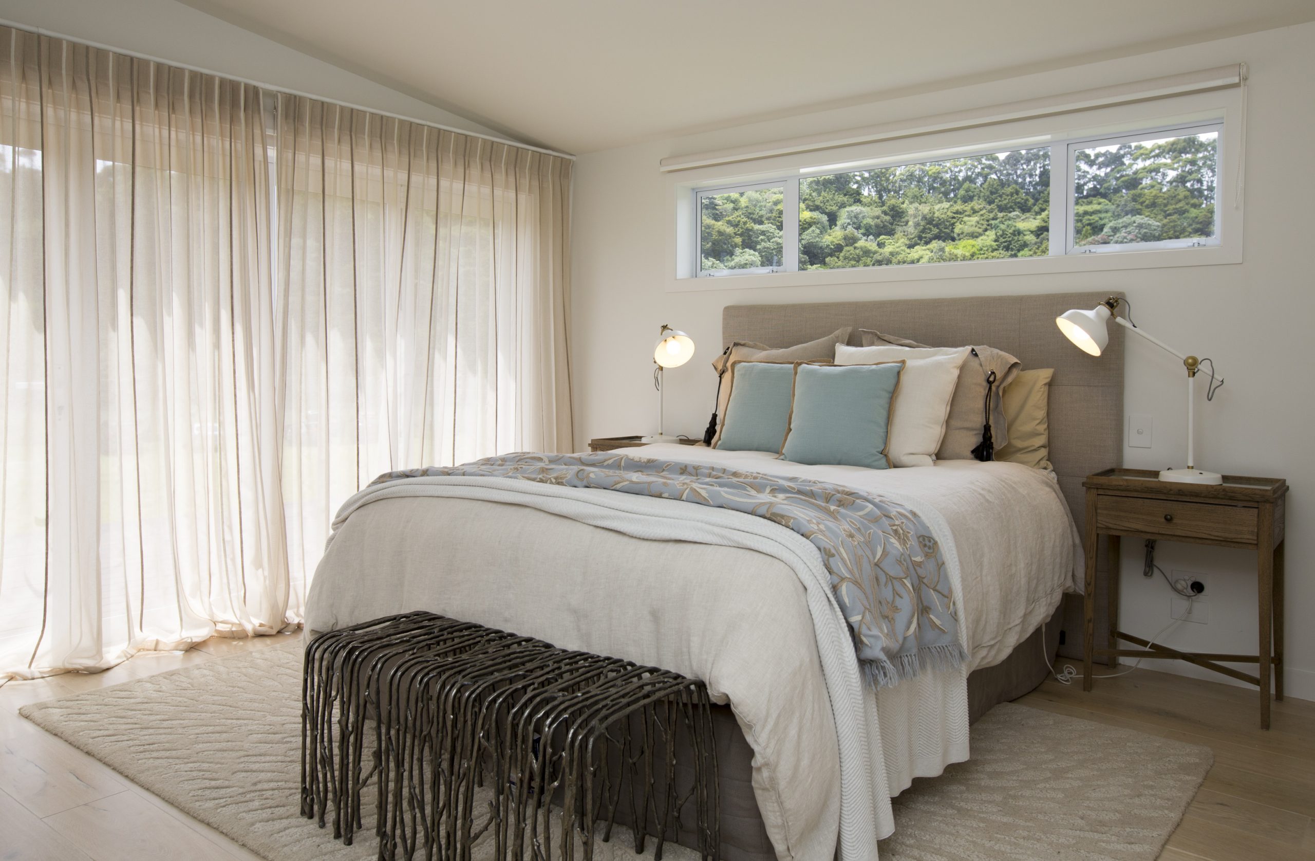 Elegant coastal bedroom at Sorrento Beach House featuring soft textures and natural design by Natasha Walker Interiors in Melbourne