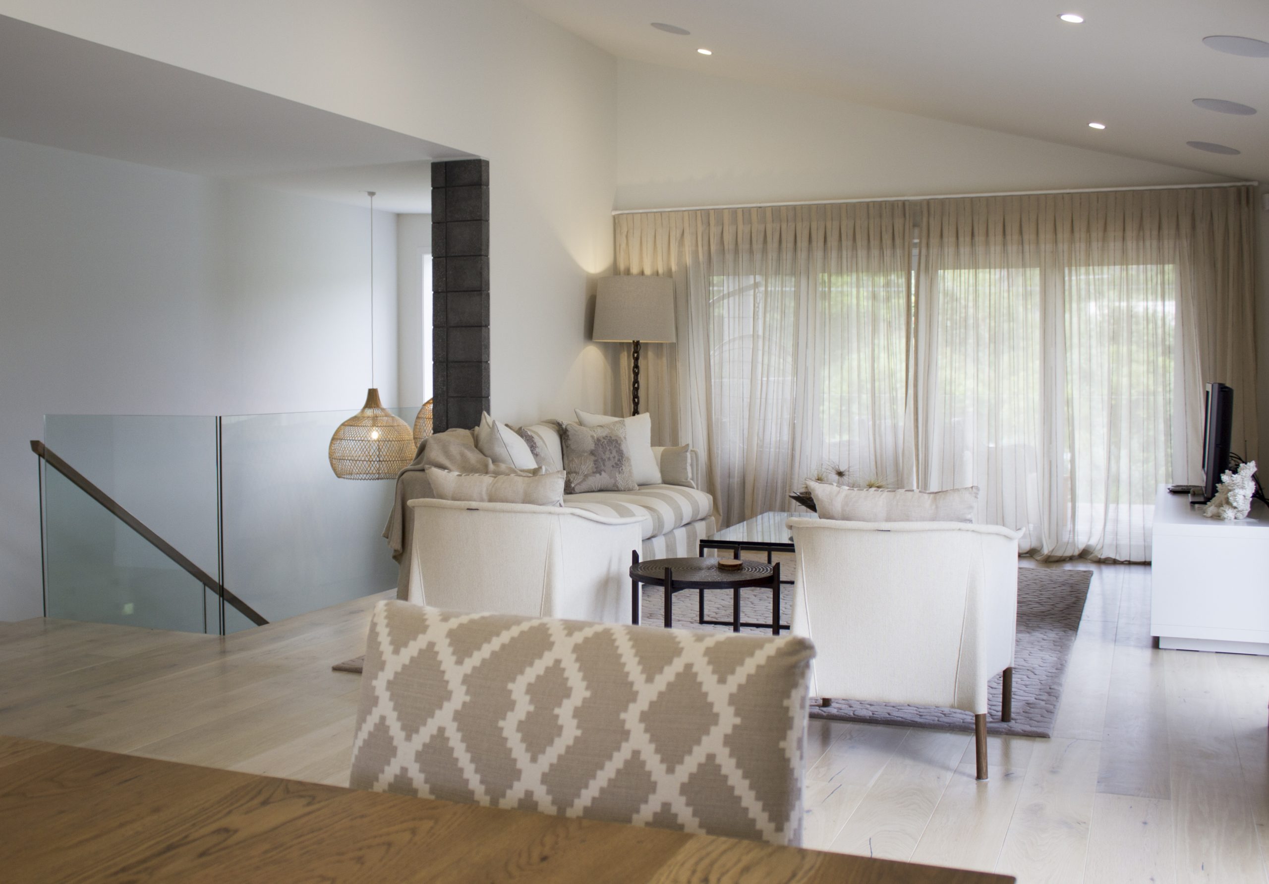 Harmonious living area designed by Natasha Walker Interiors at Sorrento Beach House, Melbourne with timeless curtains and colour palette