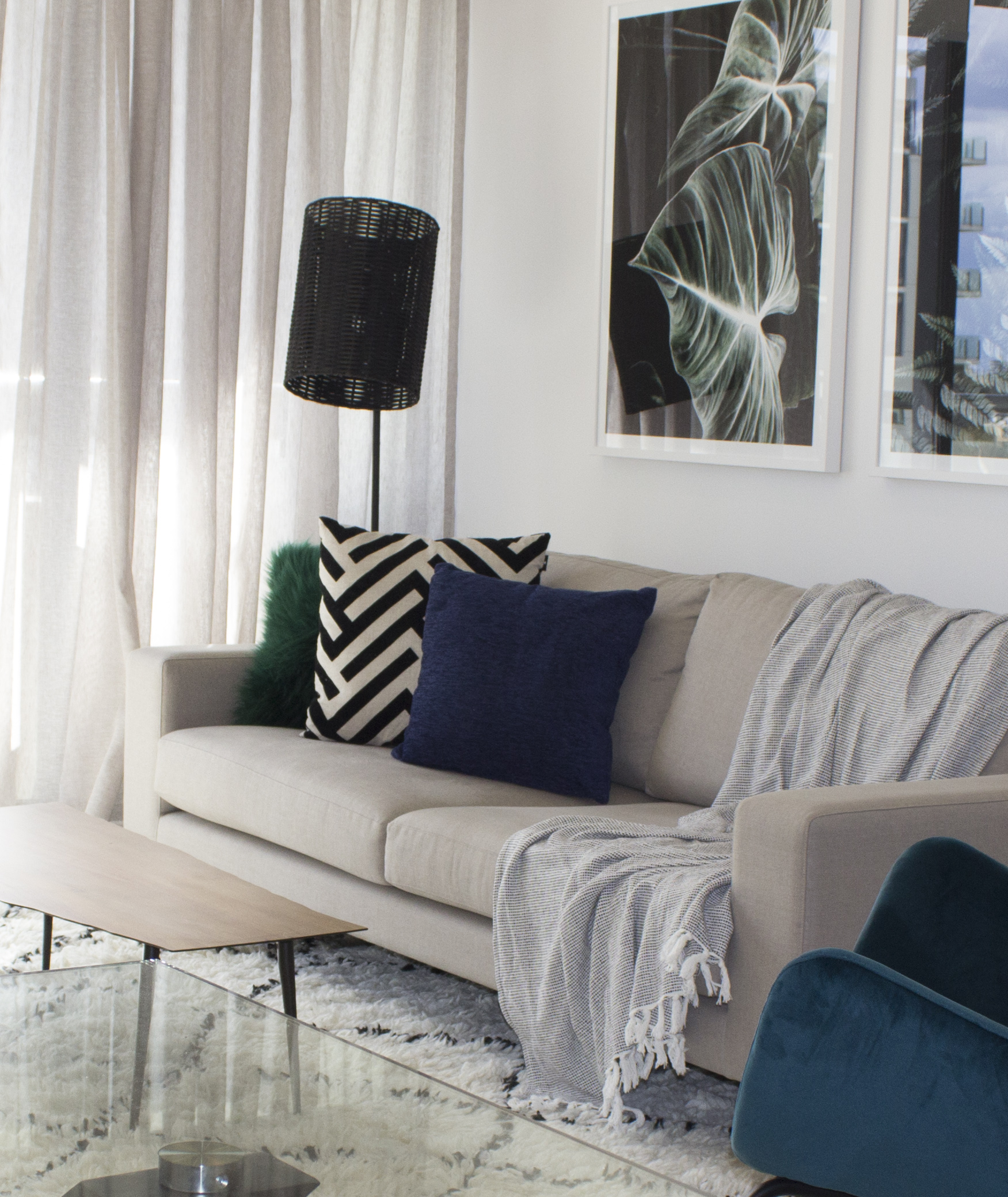 Eclectic Cool apartment living Zepel fabrics Apartment living area Apartment style Interesting spaces Natasha Walker South Melbourne Small renovation Interior design rates Nature artwork Green cushion Blue cushion Best sofa Affordable lamps Interior stylist south Melbourne White frames Leaf print artwork Blue and green interiors Feature chair Rattan lampshade Timber look coffee table